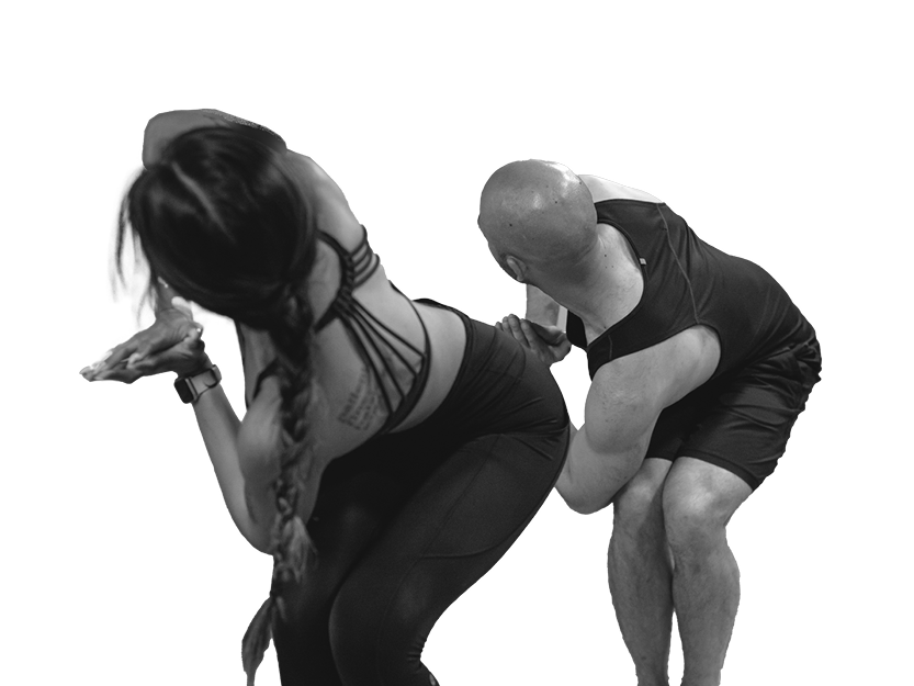 Woman and Man in Black Performing Yoga