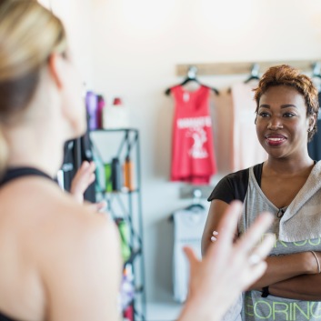 Two Women Talking in Real Hot Yoga Studio